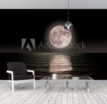 Picture of Red moon rising on the ocean